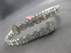LARGE 5.69CT DIAMOND 18KT WHITE GOLD ROUND & BAGUETTE INVISIBLE BANGLE BRACELET