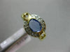 ESTATE .92CT DIAMOND & AAA OVAL TANZANITE 14KT YELLOW GOLD SEMI BEZEL LOVE RING