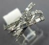 .68CT DIAMOND 14KT WHITE GOLD 3D ROUND & BAGUETTE MULTI ROW CRISS CROSS FUN RING