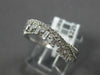 ESTATE .42CT DIAMOND 18KT WHITE GOLD 3D ROUND & BAGUETTE CRISS CROSS FUN RING