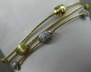 ESTATE .42CT DIAMOND 14KT TWO TONE GOLD HAMMERED BY THE YARD BANGLE BRACELET