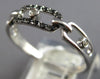 ESTATE .09CT WHITE & BLACK DIAMOND 14KT WHITE GOLD 3D OVAL LOVE KNOT FUN RING