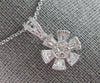 ESTATE .63CT DIAMOND 14KT WHITE GOLD 3D ROUND & BAGUETTE FLOWER FLOATING PENDANT