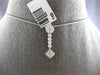 .50CT DIAMOND 14KT WHITE GOLD ROUND & PRINCESS INVISIBLE FLOWER FLOATING PENDANT