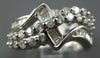 ESTATE WIDE 1.36CT DIAMOND 18KT WHITE GOLD ROUND & BAGUETTE CRISS CROSS FUN RING