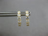 ESTATE .62CT DIAMOND 18KT YELLOW GOLD ROUND 5 STONE SHARED PRONG HUGGIE EARRINGS