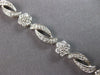 ESTATE 3.10CT DIAMOND 14KT WHITE GOLD MULTI FLOWER INFINITY LOVE TENNIS BRACELET