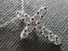 ESTATE .64CT DIAMOND 14KT WHITE GOLD SHARED PRONG INVISIBLE CROSS PENDANT #27677
