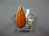 .09CT DIAMOND & AAA ORANGE AGATE 14KT ROSE GOLD PEAR SHAPE CRISS CROSS FUN RING