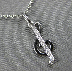 ESTATE .06CT DIAMOND 14KT WHITE GOLD CLASSIC MUSICAL NOTE FUN FLOATING PENDANT