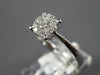 ESTATE .34CT DIAMOND 18KT WHITE GOLD ROUND 3D CLUSTER INVISIBLE ENGANGEMENT RING
