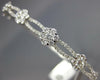 ESTATE WIDE 1.24CT DIAMOND 18KT WHITE GOLD ROUND INFINITY FLOWER BANGLE BRACELET