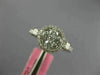 ESTATE .86CT DIAMOND 18KT WHITE GOLD 3D ROUND & PRINCESS FLOWER HALO LOVE RING