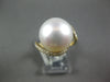 LARGE .32CT DIAMOND & AAA SOUTH SEA PEARL 18KT YELLOW GOLD CRISS CROSS LOVE RING
