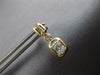 ESTATE .29CT DIAMOND 14KT YELLOW GOLD 3D ROUND & BAGUETTE HANGING EARRINGS
