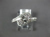 ESTATE .83CT DIAMOND 14KT WHITE GOLD 3D ROUND & BAGUETTE CRISS CROSS FUN RING