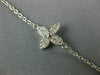 ESTATE .53CT DIAMOND & WHITE ENAMEL 18KT WHITE GOLD FLOWER BY THE YARD NECKLACE