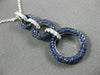 2.16CT DIAMOND & SAPPHIRE 18KT WHITE & BLACK GOLD CIRCULAR JOURNEY LOVE PENDANT