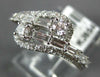 ESTATE .83CT DIAMOND 14KT WHITE GOLD 3D ROUND & BAGUETTE CRISS CROSS FUN RING