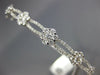 ESTATE WIDE 1.24CT DIAMOND 18KT WHITE GOLD ROUND INFINITY FLOWER BANGLE BRACELET