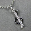 ESTATE .06CT DIAMOND 14KT WHITE GOLD CLASSIC MUSICAL NOTE FUN FLOATING PENDANT