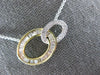.54CT DIAMOND 14KT 2 TONE GOLD 3D ROUND & BAGUETTE DOUBLE OVAL LOVE KNOT PENDANT