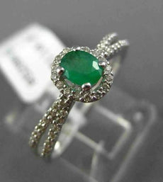 ESTATE .55CT DIAMOND & EMERALD 14KT WHITE GOLD CLASSIC OVAL HALO ENGAGEMENT RING