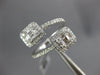LARGE .68CT DIAMOND 18K WHITE GOLD ROUND & BAGUETTE SQUARE CRISS CROSS LOVE RING