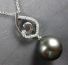 ESTATE LARGE. 15CT DIAMOND & AAA TAHITIAN PEARL 18K WHITE GOLD LOVE KNOT PENDANT