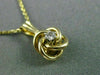 ESTATE SMALL .03CT DIAMOND 14KT YELLOW GOLD 3D FLOATING LOVE KNOT PENDANT #25417