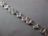3.98CT DIAMOND 18KT WHITE GOLD INVISIBLE FLOWER OVAL BY THE YARD TENNIS BRACELET