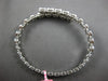 2.67CT DIAMOND 18K WHITE GOLD OVAL BEZEL INVISIBLE SEMI ETERNITY BANGLE BRACELET