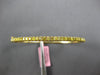 1.1CT INTENSE FANCY YELLOW DIAMOND 18KT YELLOW GOLD SHARED PRONG BANGLE BRACELET