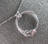 ESTATE .03CT DIAMOND 14KT WHITE GOLD SOLITAIRE LOVE KNOT CIRCLE OF LIFE NECKLACE