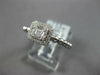 ESTATE .27CT DIAMOND 18KT WHITE GOLD ROUND & BAGUETTE INVISIBLE HALO BEADED RING