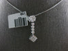 .50CT DIAMOND 14KT WHITE GOLD ROUND & PRINCESS INVISIBLE FLOWER FLOATING PENDANT