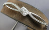 LARGE 1.13CT DIAMOND 14KT WHITE GOLD CRISS CROSS INFINITY 2 STONE LOVE BRACELET