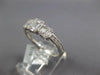 ESTATE .64CT DIAMOND 18KT WHITE GOLD ROUND & BAGUETTE INVISIBLE SQUARE LOVE RING