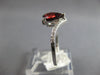 1.18CT DIAMOND & AAA GARNET 14KT WHITE GOLD PEAR SHAPE & ROUND CRISS CROSS RING