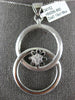 ESTATE LARGE .19CT DIAMOND 18KT WHITE GOLD FLOWER LOVE KNOT CIRCULAR FUN PENDANT