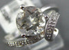 ESTATE 1.33CT DIAMOND & AAA WHITE TOPAZ 14KT WHITE GOLD LOVE KNOT SOLITAIRE RING