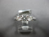 .64CT DIAMOND 18KT WHITE GOLD ROUND 3 STONE PAST PRESENT FUTURE ENGAGEMENT RING