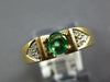SMALL .70CT DIAMOND & AAA EMERALD 18K YELLOW GOLD OVAL & ROUND TRILLION FUN RING