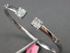 WIDE .72CT DIAMOND 18KT WHITE GOLD 3D ROUND & BAGUETTE FLEXIBLE BANGLE BRACELET