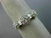 ESTATE .85CT ROUND & BAGUETTE DIAMOND 18KT WHITE GOLD 3 FLOWER ANNIVERSARY RING