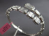 EXTRA LARGE 6.07CT DIAMOND 18KT WHITE GOLD ROUND & BAGUETTE 3D BANGLE BRACELET