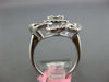 .93CT DIAMOND 18K WHITE GOLD ROUND & BAGUETTE CLUSTER INVISIBLE FLOWER LOVE RING