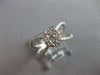 ESTATE LARGE .64CT DIAMOND 14KT WHITE GOLD FLOWER CRISS CROSS INFINITY LOVE RING