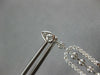 LONG 1.25CT DIAMOND 14KT WHITE GOLD ROUND & BAGUETTE HORSESHOE HANGING EARRINGS