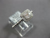ESTATE .27CT DIAMOND 18KT WHITE GOLD ROUND & BAGUETTE INVISIBLE HALO BEADED RING